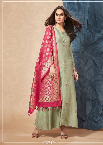 This Season Is About Subtle Shades And Pastel Play, So Grab This Designer Readymade Kurti In Pastel Green Colored Top Paired With Contrasting Dark Pink Colored Dupatta. Its Hand Embroidered Top Is Fabricated On soft Silk Paired With Rich Banarasi Art Silk Dupatta. Buy This Lovely Pair Now.