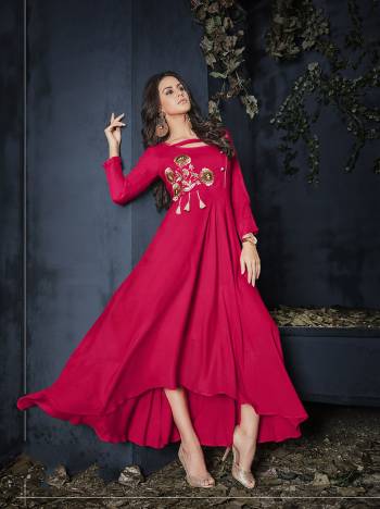 Shine Bright In This Readymade Designer Gown In Dark Pink Color Fabricated On Rayon Beautified With Thread Work. It Has Pretty High Low Pattern And You can Wear It As it Is Or Pair Up With A Leggings. Buy Now.