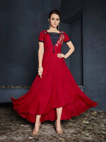 Shine Bright In This Readymade Designer Gown In Red Color Fabricated On Rayon Beautified With Thread Work. It Has Pretty High Low Pattern And You can Wear It As it Is Or Pair Up With A Leggings. Buy Now.