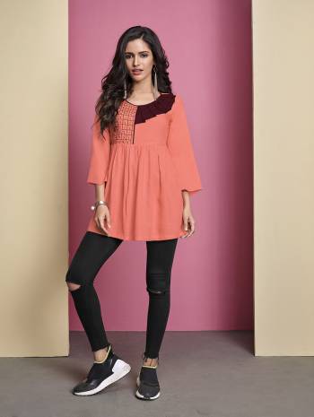 Grab This Pretty Readymade Top In Dark Peach Color Fabricated On Rayon. It Has Attractive Front Pattern With Thread Work. Buy This As Per Your Desired Fit And Comfort. 