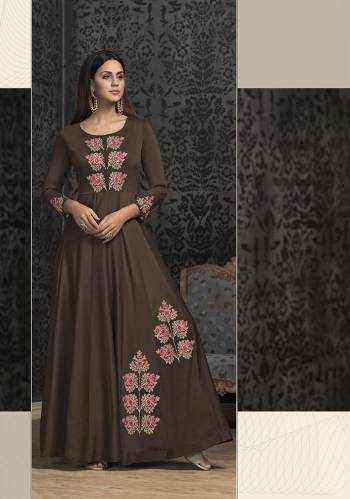 Rich And Elegant Looking Designer Readymade Gown Is Here In Dark Brown Color Which IS Near To Black. It IS Fabricated On Muslin With Very Pretty Atractive Embroidery. Buy This Lovely Piece Now.