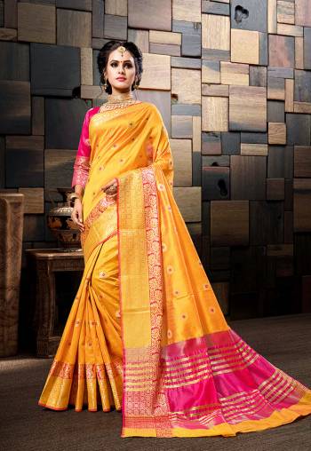 Celebrate This Festive Season Wearing This Designer Silk Based Saree In Musturd Yellow Color Paired With Contrasting Rani Pink Colored Blouse. Its Rich Cotton Silk Fabric Gives An Elegant Look To Your Personality. 