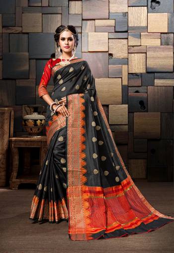 For A Bold And Beautiful Look, Grab This Designer Saree In Black Color Paired With Contrasting Red Colored Blouse. This Saree And Blouse Are Fabricated Cotton Silk Beautified With Weave. It Is Light In Weight And Easy To Carry All Day Long. 