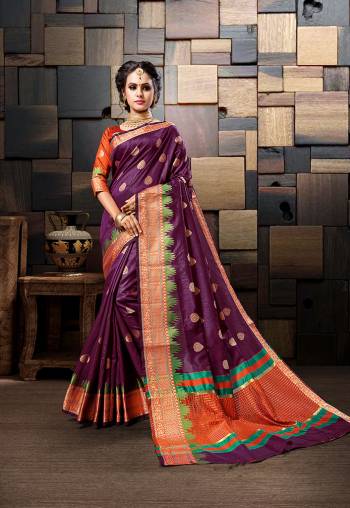 Add This Very Pretty Designer Saree To Your Wardrobe In Purple Color Paired With Contrasting Orange Colored Blouse. This Saree And Blouse Are Fabricated On Cotton Silk Beautified With Weave. 