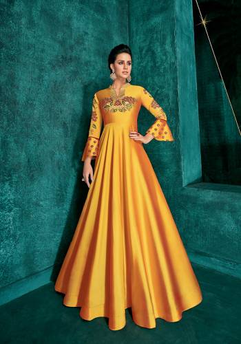 Celebrate This Festive Season Wearing This Designer Readymade Gown In Musturd Yellow Color Fabricated On Soft Art Silk Beautified With Embroidery. Its Rich Fabric And Color Will Definitely Earn You Lots Of Compliments From Onlookers.