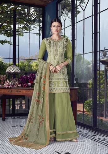 Here Is A Very Pretty And Elegant Looking Designer Sharara Suit In All Over Light Green Color. Its Heavy Embroidered Top Is Fabricated On Soft Silk Paired With Net Fabricated Bottom And Jacquard Silk Dupatta. All Its Fabric Are Light Weight And Easy To Carry All Day Long.