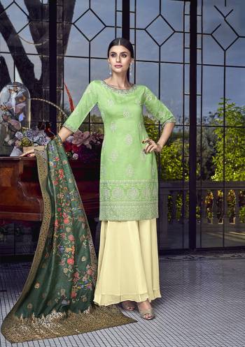 Grab This Very Pretty Designer Sharara Suit In Light Green Colored Top Paired With Cream Colored Bottom And Dark Green Colored Dupatta. Its Top IS Fabricated On Soft Silk Paired With Georgette Bottom And Jacquard Silk Dupatta. Its Rich Color Pallete And Fabric Will eArn You Lots Of Compliments From Onlookers.