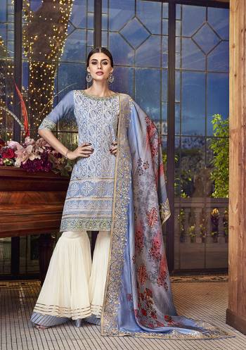 Flaunt Your Rich And Elegant Taste In This Subtle Color Pallet with This Designer Heavy Sharara Suit In Steel Blue Colored Top And Dupatta Paired With White Colored Bottom. Its Top IS Fabricated On Soft Silk Paired With Georgette Bottom And Jacquard Silk Fabricated Dupatta. Buy Now.