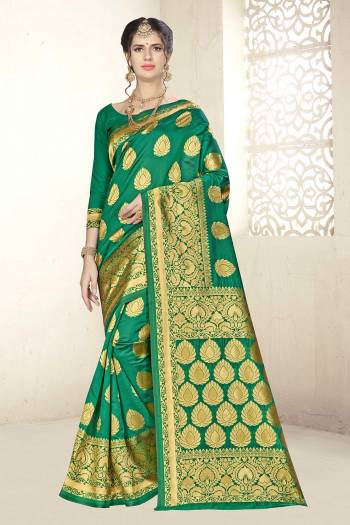 Add This Very Pretty Silk Based Saree To Your Wardrobe In Green Color. This Saree Is Fabricated On Banarasi Art Silk Paired With Art Silk Fabricated Blouse. It Is Beautified With Floral Weave All Over It