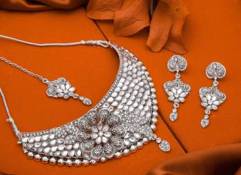 Here Is Trending Heavy Necklace Set In Silver Color Beautified With Attractive Diamond Work. Get Ready For The Upcoming Wedding Season with This Very Beautiful Necklace Set Which Can Be Paired With Any Colored Ethnic Attire, Best Suitable With Saree Or Lehenga. Buy Now.