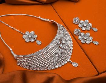 Here Is Trending Heavy Necklace Set In Silver Color Beautified With Attractive Diamond Work. Get Ready For The Upcoming Wedding Season with This Very Beautiful Necklace Set Which Can Be Paired With Any Colored Ethnic Attire, Best Suitable With Saree Or Lehenga. Buy Now.