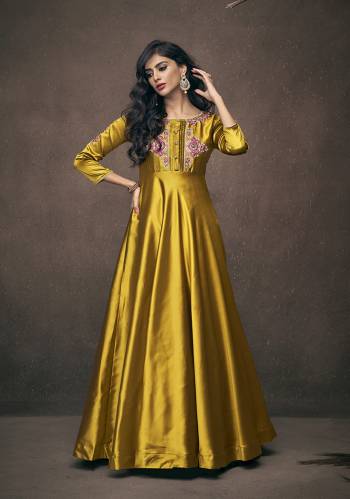 Here Is A Very Pretty Designer Readymade Gown In Yellow Color Fabricated On Satin Silk. This Pretty Gown Is Beautified With Attractive Embroidery Over The Yoke And Sleeves. Also It Is Light In Weight And Easy To Carry Throughout The Gala.