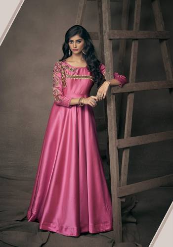 Get Ready For The Upcoming Festive And Wedding Season With This Designer Readymade Gown In Rani Pink Fabricated On Satin Silk. This Pretty Gown Has Attractive Embroidery Over The Yoke And Sleeves. Buy Now.