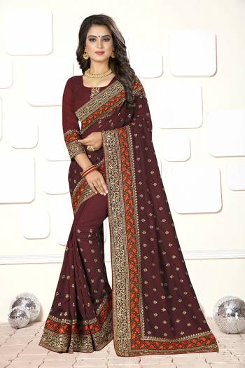 Here Is A Very Pretty Heavy Designer Saree For In Maroon Color For The Upcoming Wedding And Festive Season. This Saree And Blouse Are Fabricated On Art Silk Beautified With Heavy Thread And Jari Embroidery. This Kashmiri Style Embroidery And Rich Fabric Will Earn You Lots Of Compliments From Onlookers.