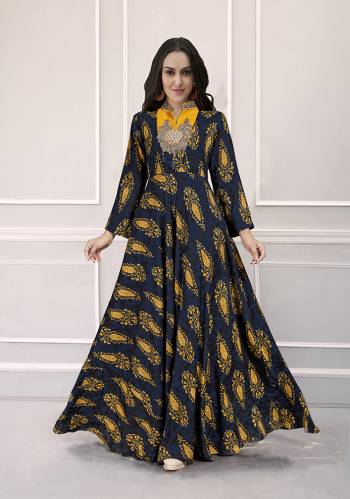 Grab This Very Beautiful Designer Readymade Gown In Navy Blue Color Fabricated On Rayon. This Pretty Gown Is Beautified With Prints All Over And Hand Work. Choose Your Size As Per Your Desired Fit And Comfort. 