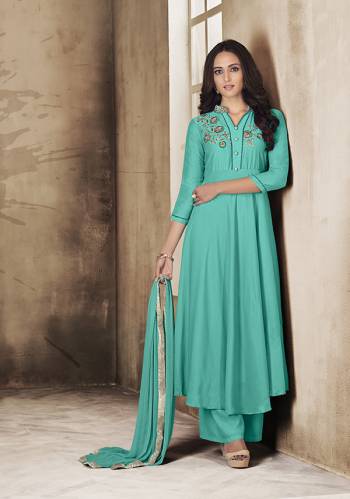 Here Is A Very Pretty Readymade Suit In Turquoise Blue Color For The Upcoming Festive Season. Its Top And Plazzo Are Fabricated On Muslin Paired With Chiffon Fabricated Dupatta. Buy Now.