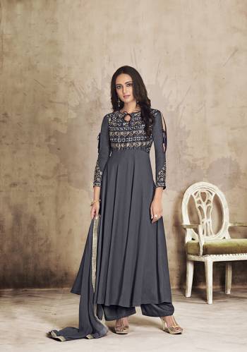 For A Bold And Beautiful Look, Grab This Readymade Designer Plazzo Suit In All over Dark Grey Color. Its Top And Plazzo Are Muslin Based Paired With Chiffon Fabricated Dupatta. This New Trending Pattern In Long Top With Plazzo Will Definitely Earn You Lots Of Compliments From Onlookers.