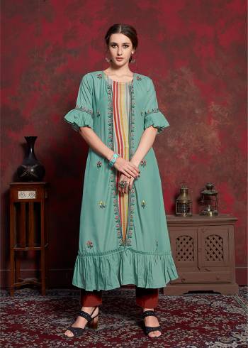 Here Is A Beautiful Jacket Patterned Designer Readymade Kurti In Multi Colored Inner With Light Blue Colored Jacket. Printed Inner Is Fabricated On Rayon Cotton Paired With Muslin Fabricated Embroidered Jacket. It Is Light In Weight And Easy To Carry All Day Long. 