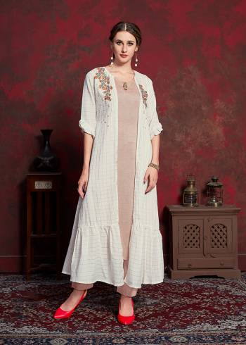 Celebrate This Festive Season With Beauty And Comfort Wearing This Designer Readymade Kurti In Beige Colored Inner Paired With White Colored Jacket. Its Inner Is Fabricated On Rayon cotton Paired With Muslin Fabricated Jacket. Its Rich And Subtle Color Pallete Will Earn You Lots Of Compliments From Onlookers. 