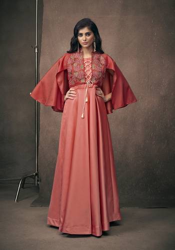 Adorn The Pretty Angelic Look, Wearing This Heavy Designer Readymade Gown In Red Color Fabricated On Satin Silk. Its Is Beautified with Attractive Embroidery Over Yoke With Bell Sleeve Pattern. 