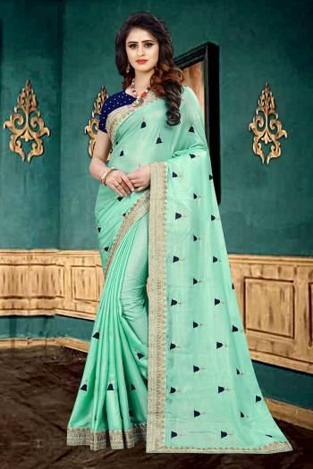 Look Pretty In This Lovely Designer Saree In Sea Green Color Paired With Contrasting Navy Blue Colored Blouse. This Pretty Saree Is Fabricated On Georgette Paired With Brocade Fabricated Blouse. It Is Beautified With Heavy Embroidered Lace Border And Butti All Over It. It Has Attractive Georgette Fabric With Glitter Padding. Buy Now.