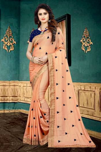 Get Ready For The Upcoming Festive Or Party With This Beautiful Designer Georgette Based Saree In Dark Peach Color Which Has Lovely Glitter Padding Paired With Contrasting Navy Blue Colored Brocade Blouse. It Is Beautified with Elegant And Subtle Embroidered Lace Border And Butti. 