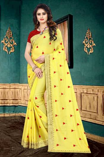 Look Pretty In This Lovely Designer Saree In Yellow Color Paired With Contrasting Red Colored Blouse. This Pretty Saree Is Fabricated On Georgette Paired With Brocade Fabricated Blouse. It Is Beautified With Heavy Embroidered Lace Border And Butti All Over It. It Has Attractive Georgette Fabric With Glitter Padding. Buy Now.