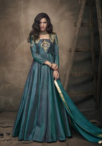 New Shade IS Here To Add Into Your Wardrobe With This Readymade Designer Gown In Teal Green Color Paired With Teal Green Colored Dupatta. Its Top IS Fabricated On Tafeta Art Silk Paired With Chiffon Fabricated Dupatta. It Is Beautified With Embroidery Over The Yoke And Sleeves. 