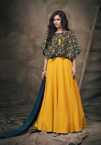 Get Ready For The Next Party At Your Place With This Designer Readymade Gown In Musturd Yellow Color With A Very Pretty And Heavy Embroidered Pine Green Colored Cape And Pine Colored Dupatta. This Pretty Gown IS Georgette Based Paired With Chiffon Fabricated Dupatta. Also It IS Light In Weight And Easy To Carry All Day Long. 