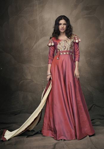 Celebrate This Festive Season Wearing This Attractive Looking Readymade Gown In Dark Pink Color Paired With Cream Colored Dupatta. Its Heavy Embroidered Gown IS Fabricated On Tafeta Art Silk Paired With Chiffon Fabricated Dupatta. 