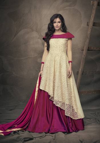 Here Is Beautiful Designer Piece In Cream Colored Top Paired With Contrasting Magenta Pink Colored Lehenga And Dupatta. Its Readymade Top Is Fabricated On Fancy Net Paired With Readymade Tafeta Art Silk Lehenga And Chiffon Dupatta. Choose Your Size As Per Your Desired Fit And Comfort. 