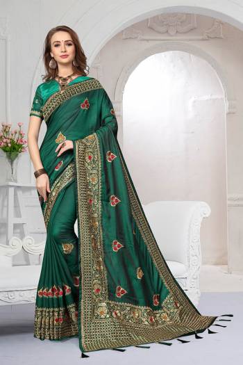 Rich And Elegant Looking Heavy But Subtle Look Designer Saree Is Here In Pine Green Color. This Pretty Embroidered Saree And Blouse are Fabricated On Satin Silk Beautified With Jari And Resham Work. Its Rich Fabric And Color Will Definitely Earn You Lots Of Compliments From Onlookers.