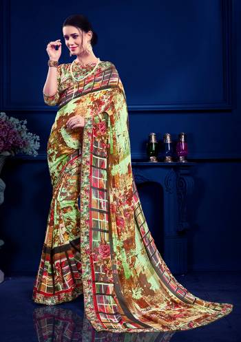 For Youe Semi-Casuals, Grab This Printed Saree In Multi Color Paired With Multi Colored Blouse. This Saree Is Georgette Based Paired With art Silk Fabricated Blouse. Its Fabric Is Light Weight And Easy To Carry All Day Long. 