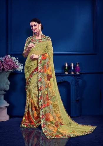 For Youe Semi-Casuals, Grab This Printed Saree In Olive Green Color Paired With Multi Colored Blouse. This Saree Is Georgette Based Paired With art Silk Fabricated Blouse. Its Fabric Is Light Weight And Easy To Carry All Day Long. 