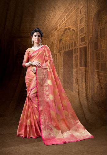 Here Is A Rich Silk Based Designer Saree In Peach Color Paired With Dark Pink Colored Blouse. This Saree And Blouse Are Fabricated On Art Silk Beautified With Weave All Over It. Its Rich Fabric And Color Will Definitely Earn You Lots Of Compliments From Onlookers.