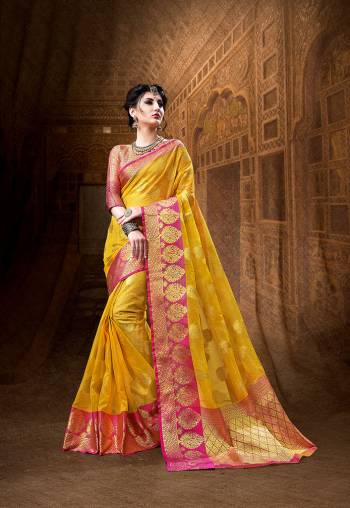 Celebrate This Festive Season Wearing This Designer Silk Based Saree In Musturd Yellow Color Paired With Contrasting Dark Pink Colored Blouse. It Is Beautified With Weave All Over Giving It Rich And Subtle Look. 