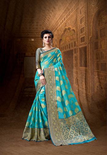 Attract All Wearing This Designer Saree In Sky Blue Color Paired With Contrasting Navy Blue Colored Blouse. This Saree And Blouse Are Fabricated On Art Silk Beautified With Heavy Weave All Over It. Buy This Pretty Attractive Saree Now.