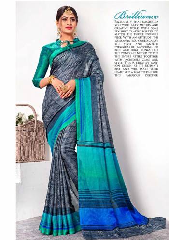 Attract All In This Printed Dark Grey Colored Saree Paired With Contrasting Sea Green Colored Blouse. This Saree And Blouse are Fabricated On Linen Silk Beautified Prints All Over. Its Fabric Gives A Rich Look And Is Light In Weight To Carry All Day Long. 