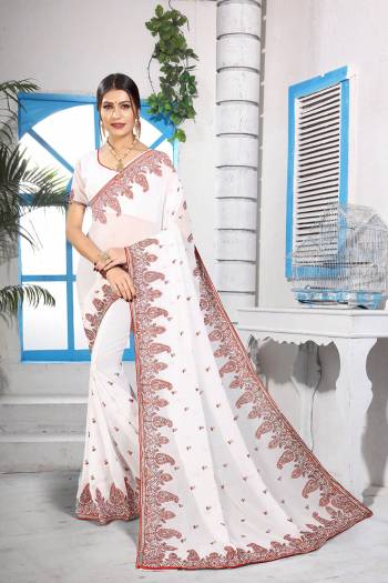 Simple And Elegant Looking Designer Saree With Attractive Kashmiri Work IS Here In White Color. This Saree and Blouse are Georgette Based Beautified With Detailed Embroidery Giving It An Attractive Look. 