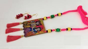 Grab This Unique Styled Necklace Set For This Navratri Festive In Multi Color. This Pretty Set Is Made Of Wood and Threads Beautified With Prints And Bead Work. You Can Pair This Up With Any Contrasting Colored Attire. Buy Now.