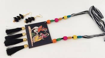 Grab This Unique Styled Necklace Set For This Navratri Festive In Multi Color. This Pretty Set Is Made Of Wood and Threads Beautified With Prints And Bead Work. You Can Pair This Up With Any Contrasting Colored Attire. Buy Now.