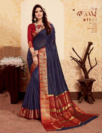 Here Is An Bold Color  Pallete With This Silk Based Saree In Navy Blue Color Paired With Contrasting Red Colored Blouse. This Saree And Blouse Are Fabricated On Banarasi Art Silk Beautified Weave. 