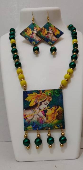 Grab This Unique Styled Necklace Set For This Navratri Festive In Multi Color. This Pretty Set Is Made Of Wood and Mix Metal Beautified With Prints And Bead Work. You Can Pair This Up With Any Contrasting Colored Attire. Buy Now.