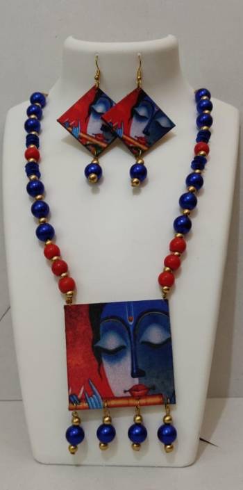 Grab This Unique Styled Necklace Set For This Navratri Festive In Multi Color. This Pretty Set Is Made Of Wood and Mix Metal Beautified With Prints And Bead Work. You Can Pair This Up With Any Contrasting Colored Attire. Buy Now.