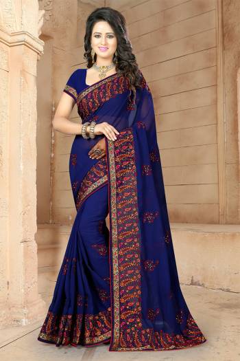 If You Have And Eye For Embroidery Than Grab This Very Beautiful Designer Saree In Navy Blue Color With Heavy Kashmiri Embroidery And Stone Work. This Pretty Saree And Blouse Are Fabricated On Georgette. Its Fabric Is Light Weight And Its Lovely Embroidery Gives An Attractive Look Over All. 