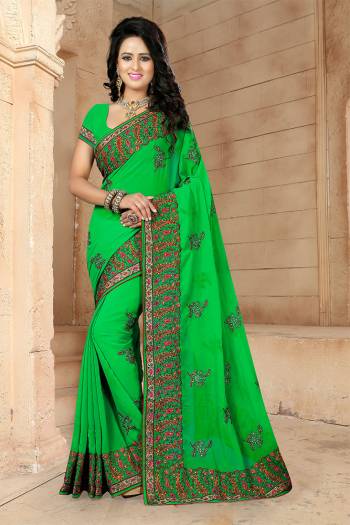 If You Have And Eye For Embroidery Than Grab This Very Beautiful Designer Saree In Green Color With Heavy Kashmiri Embroidery And Stone Work. This Pretty Saree And Blouse Are Fabricated On Georgette. Its Fabric Is Light Weight And Its Lovely Embroidery Gives An Attractive Look Over All. 