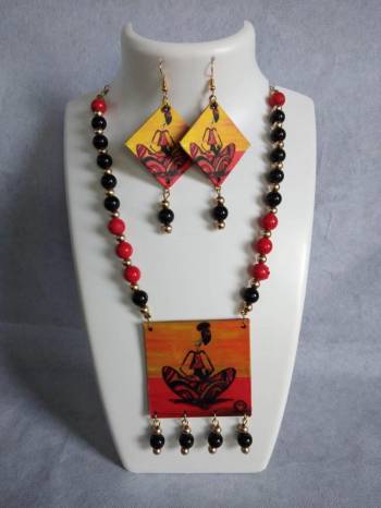 Grab This Unique Styled Necklace Set For This Navratri Festive In Multi Color. This Pretty Set Is Made Of Wood and Mix Metal Beautified With Prints And Bead Work. You Can Pair This Up With Any Contrasting Colored Attire. Buy Now.