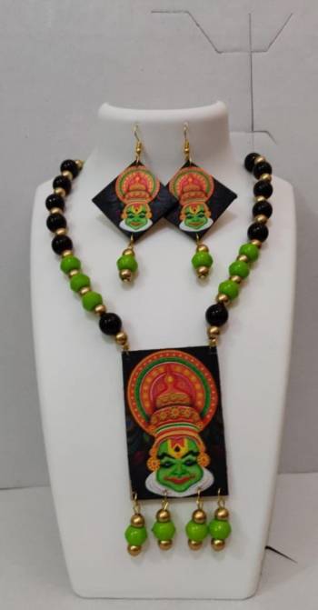 Grab This Unique Styled Necklace Set For This Navratri Festive In Multi Color. This Pretty Set Is Made Of Wood and Mix Metal Beautified With Prints And Bead Work. You Can Pair This Up With Any Contrasting Colored Attire. Buy Now.