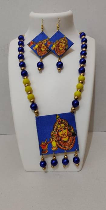 Grab This Unique Styled Necklace Set For This Navratri Festive In Multi Color. This Pretty Set Is Made Of Wood and Mix Metal Beautified With Prints And Bead Work. You Can Pair This Up With Any Contrasting Colored Attire. Buy Now.