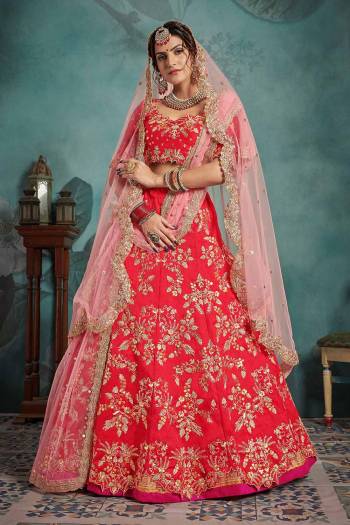 Get Ready For Your D-Day With This Heavy Designer Lehenga Choli In Red Color Paired With Baby Pink Colored Dupatta. Its Blouse And Lehenga Are Fabricated On Art Silk Paired With Two Net Dupattas. Its Lovely Bridal Color Pallete Will Earn You Lots Of Compliments From Onlookers. 